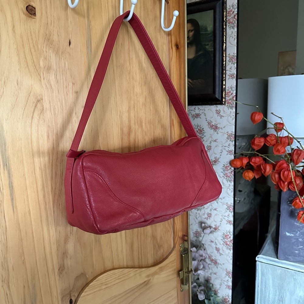 Volare Leather Classic Handbag in deep salmon. $50.